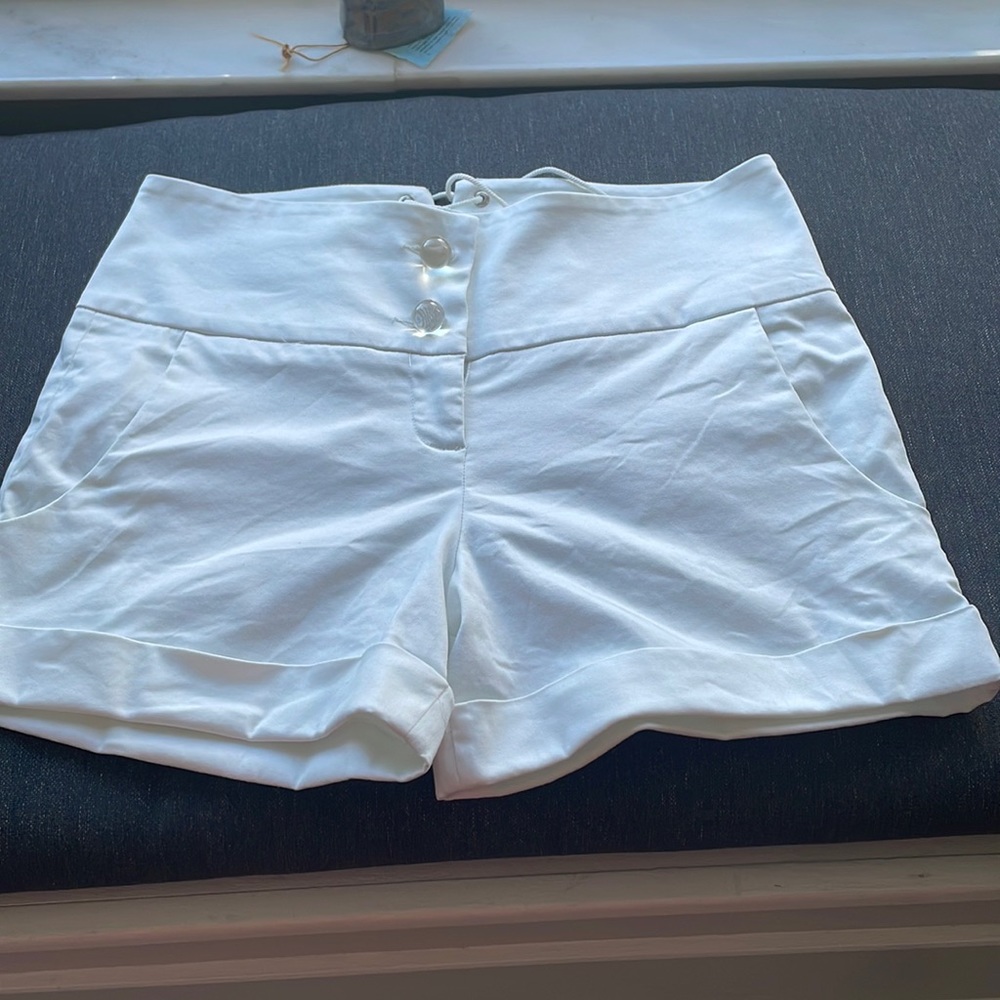 SOLD—VINTAGE Betsey Johnson white shorts with bauble buttons and tie back